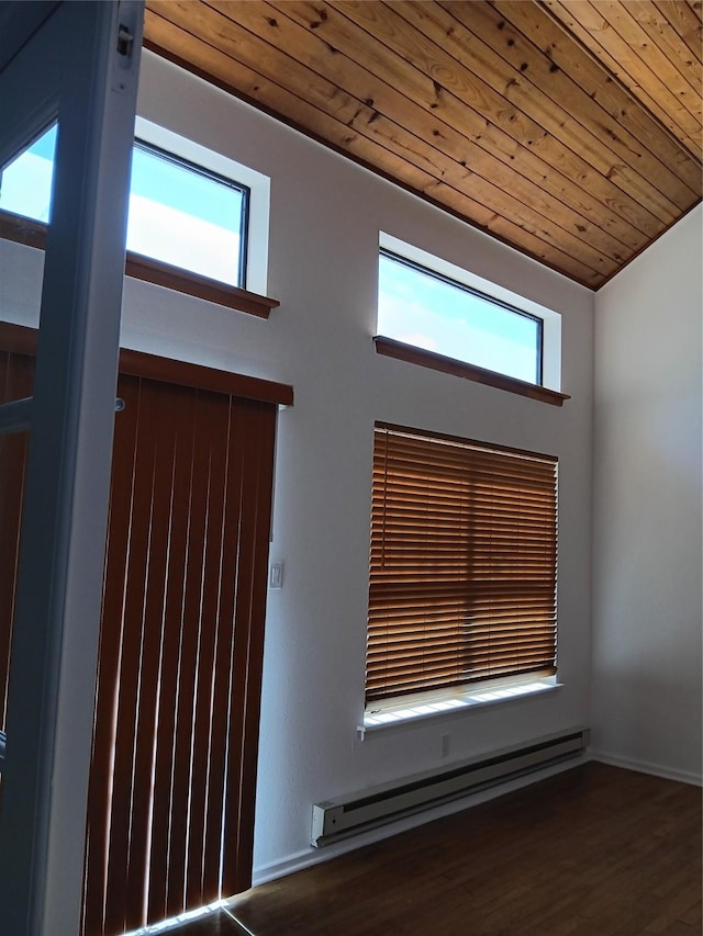 details featuring baseboard heating, wooden ceiling, wood finished floors, and baseboards