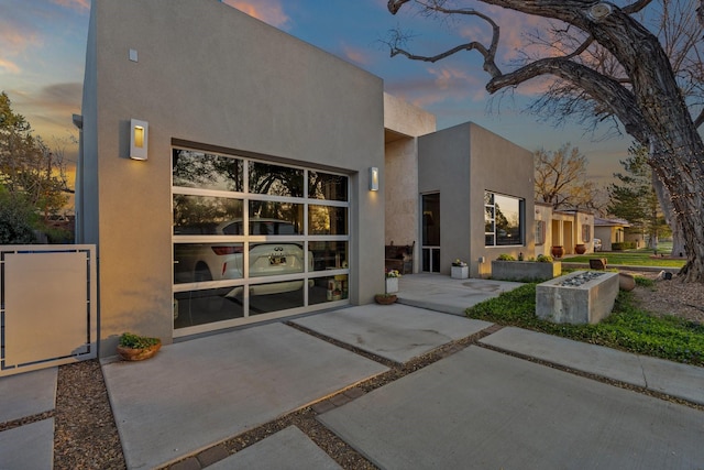 property entrance with stucco siding