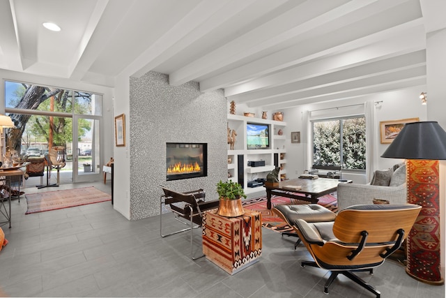 living room with beam ceiling, recessed lighting, and a fireplace