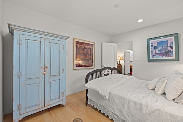 bedroom featuring light wood finished floors and recessed lighting