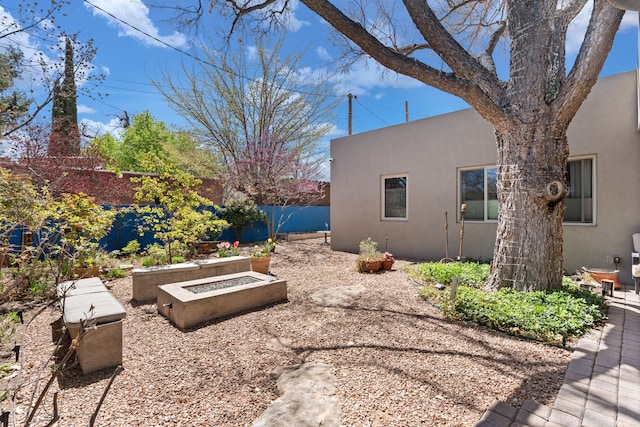 view of yard with a fenced backyard and a garden