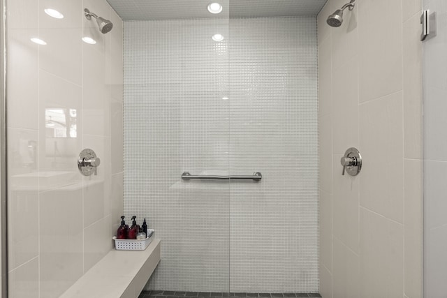 bathroom with recessed lighting and a tile shower