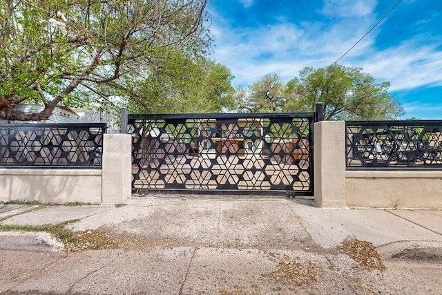 view of gate featuring a fenced front yard