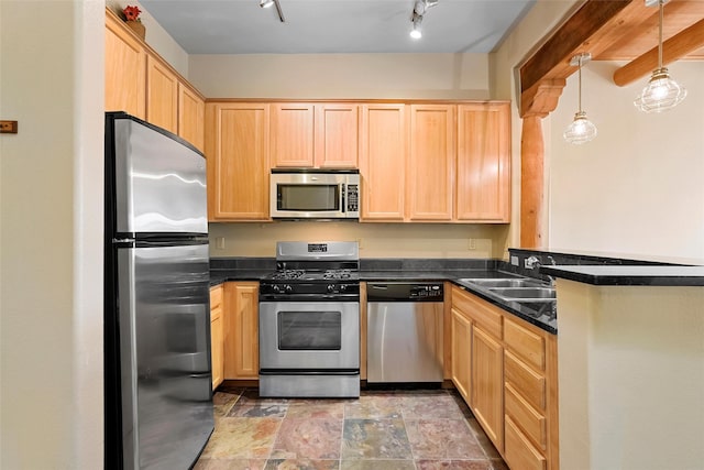 1405 Vegas Verdes Unit 341, Santa Fe, NM 87507 - kitchen with dark countertops, light brown cabinetry, a peninsula, and stainless steel appliances