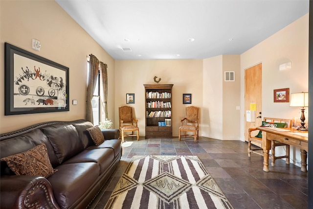 1405 Vegas Verdes Unit 341, Santa Fe, NM 87507 - living room featuring stone finish flooring, visible vents, recessed lighting, and baseboards