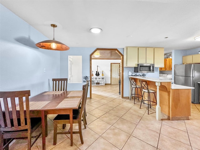 dining area with light tile patterned flooring