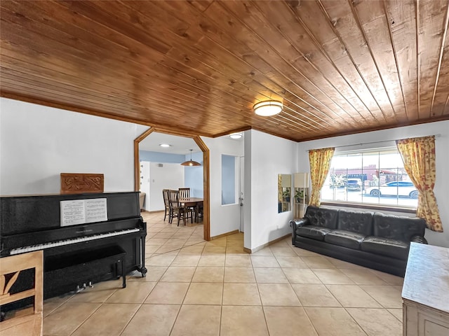 living area with wooden ceiling and light tile patterned floors