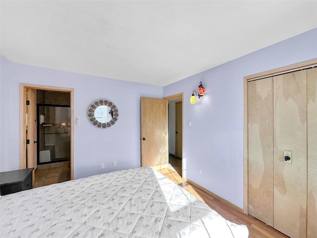 bedroom with a closet and light wood-type flooring