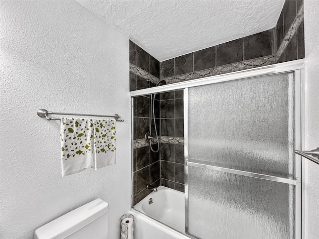 bathroom featuring toilet, a textured ceiling, enclosed tub / shower combo, and a textured wall