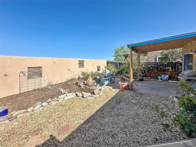 view of yard with a patio and fence
