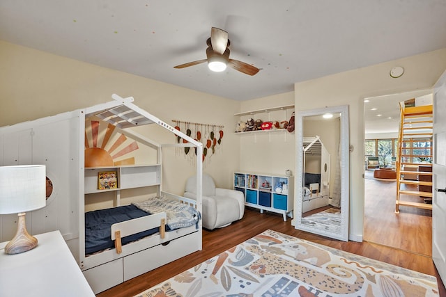 bedroom featuring a ceiling fan and wood finished floors