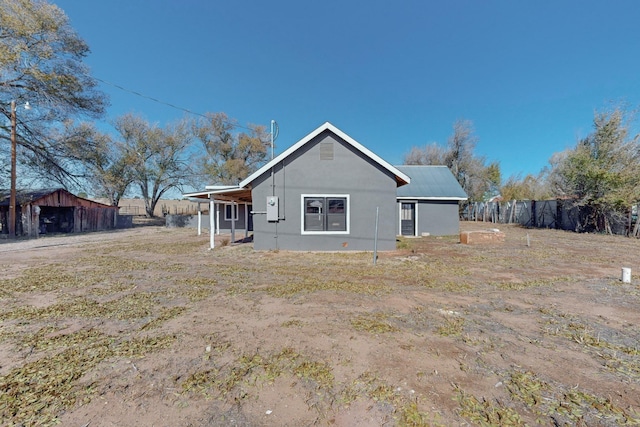 54 County Road B40A, Ribera, NM 87560 - back of property with stucco siding
