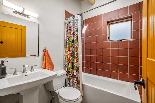 534 Hillside Ave, Santa Fe, NM 87501 - bathroom featuring toilet, shower / bathtub combination with curtain, and a sink