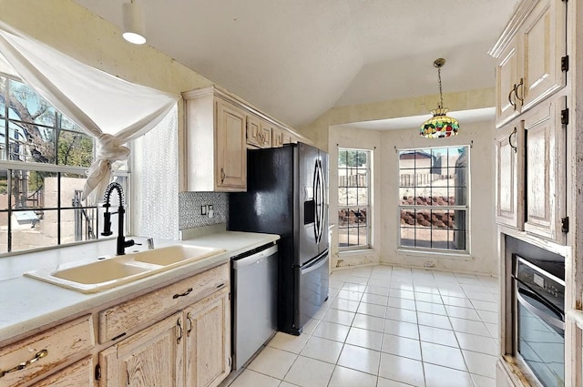 8228 Fairmont Dr NW, Albuquerque, NM 87120 - kitchen featuring stainless steel refrigerator with ice dispenser, light countertops, a sink, lofted ceiling, and dishwashing machine