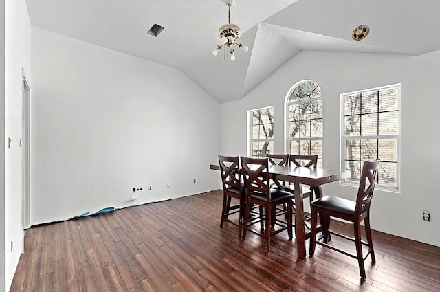 8228 Fairmont Dr NW, Albuquerque, NM 87120 - dining space featuring a notable chandelier, dark wood finished floors, and vaulted ceiling