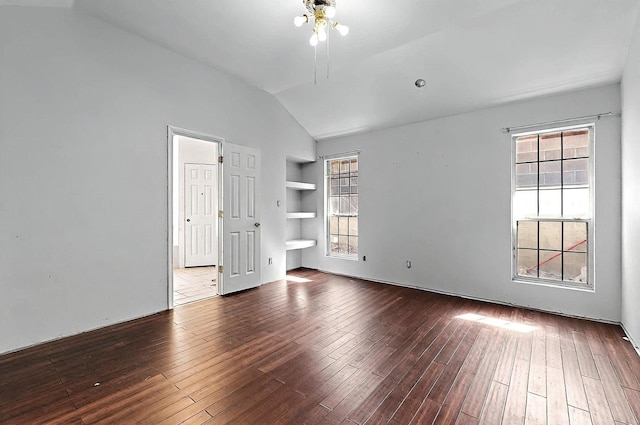 8228 Fairmont Dr NW, Albuquerque, NM 87120 - unfurnished room with a ceiling fan, built in features, vaulted ceiling, and hardwood / wood-style floors