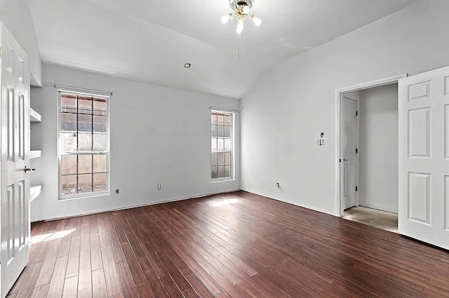 8228 Fairmont Dr NW, Albuquerque, NM 87120 - unfurnished room featuring plenty of natural light, a ceiling fan, vaulted ceiling, and wood finished floors