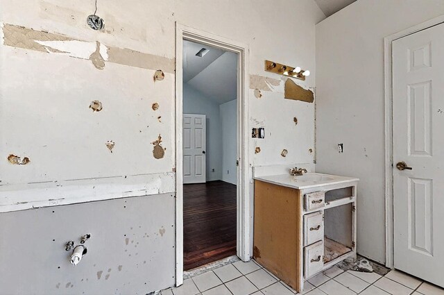 8228 Fairmont Dr NW, Albuquerque, NM 87120 - bathroom featuring vanity, tile patterned flooring, and lofted ceiling