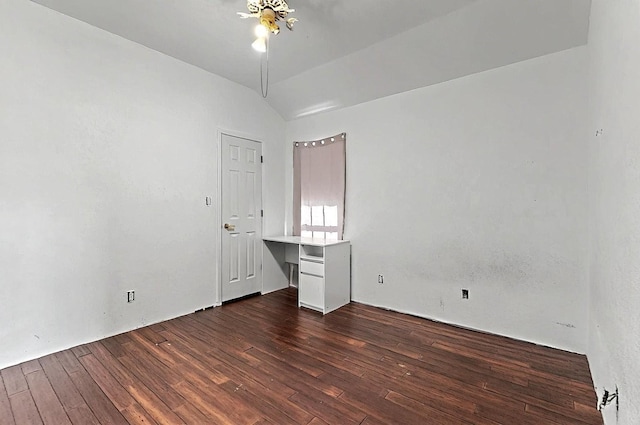 8228 Fairmont Dr NW, Albuquerque, NM 87120 - unfurnished room with a ceiling fan, dark wood finished floors, and vaulted ceiling