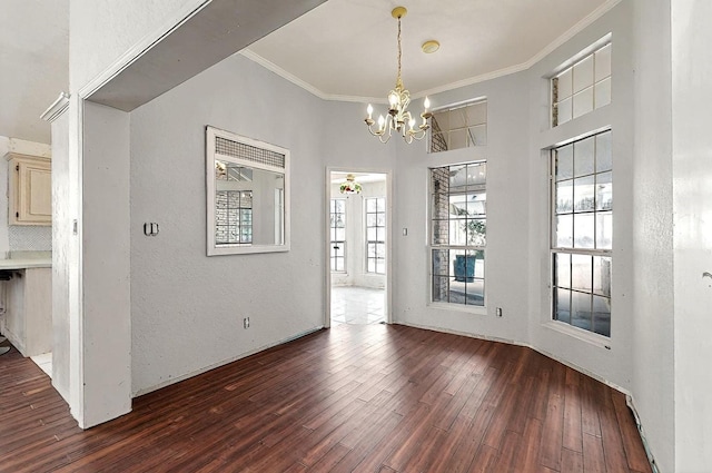 8228 Fairmont Dr NW, Albuquerque, NM 87120 - unfurnished dining area with crown molding, dark wood-style flooring, a textured wall, and a chandelier