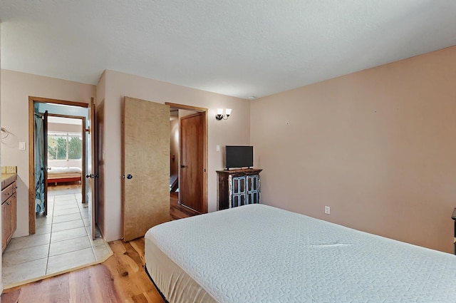 bedroom with light wood-style flooring