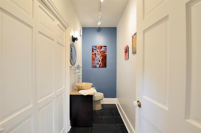 511 Armijo Unit C, Santa Fe, NM 87501 - corridor with a sink, dark tile patterned floors, baseboards, and rail lighting