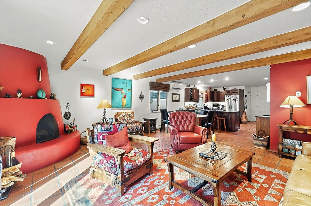 615 Bishops Lodge Rd Unit 7, Santa Fe, NM 87501 - living area featuring light tile patterned floors, beamed ceiling, an AC wall unit, and recessed lighting