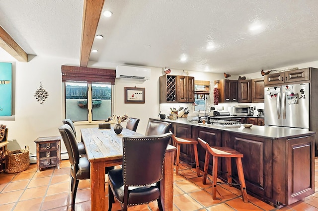 dining room featuring a textured ceiling, a wall mounted AC, light tile patterned floors, a toaster, and recessed lighting