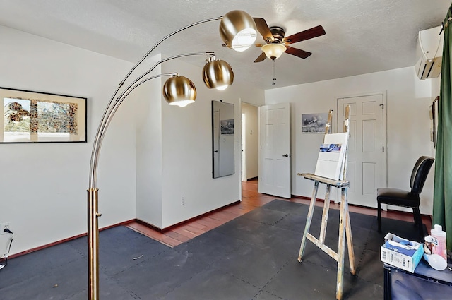 interior space featuring ceiling fan and a wall mounted AC
