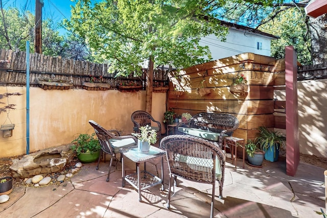 view of patio with fence