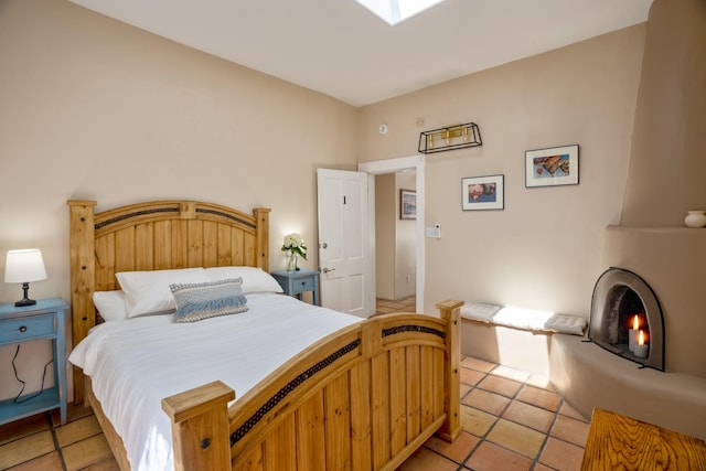 bedroom with light tile patterned flooring
