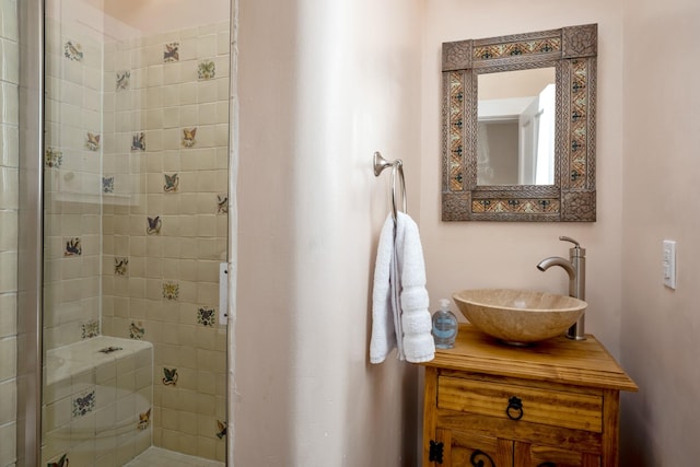 bathroom with vanity and a stall shower