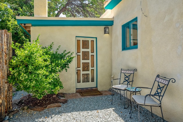 doorway to property with stucco siding