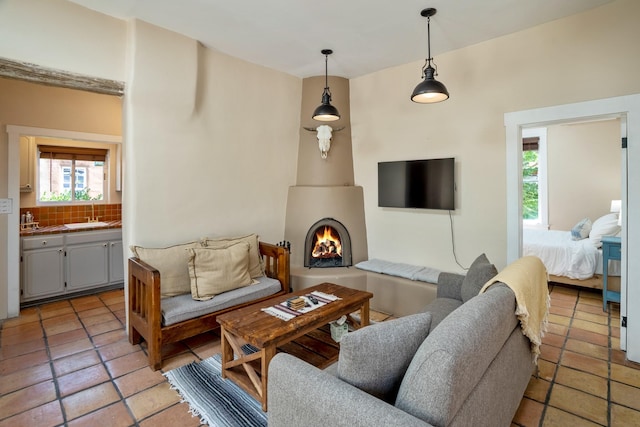 living room with light tile patterned floors and a wealth of natural light