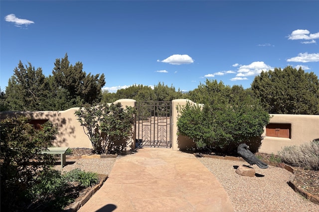view of gate with fence