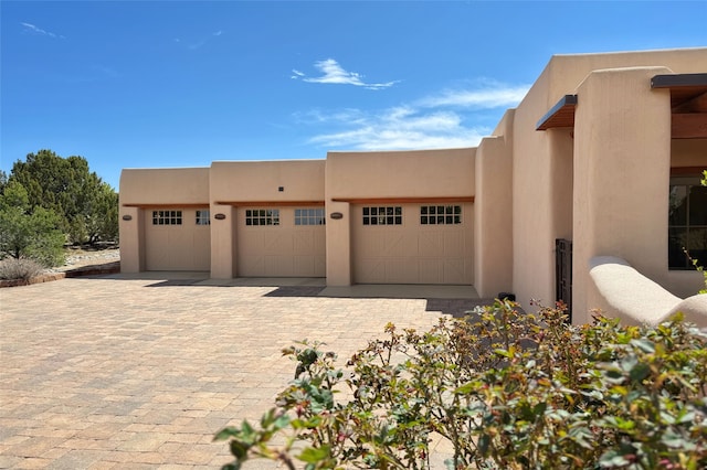 exterior space with decorative driveway