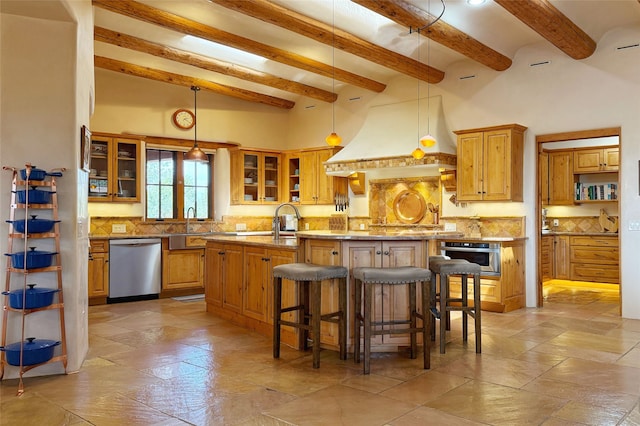 kitchen with an island with sink, a breakfast bar area, custom range hood, backsplash, and stainless steel appliances