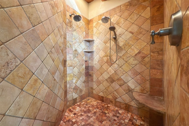 full bath featuring a tile shower