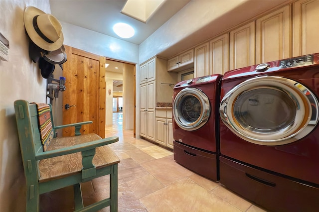laundry area featuring cabinet space and separate washer and dryer