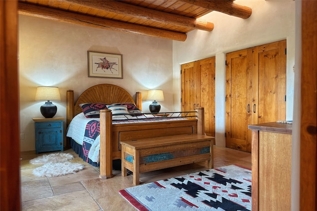 bedroom featuring wood ceiling and beamed ceiling