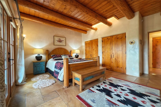 bedroom with beam ceiling and wooden ceiling