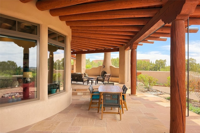 view of patio with a fenced backyard, an outdoor hangout area, and outdoor dining space
