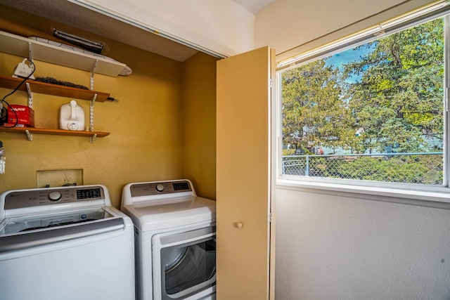 washroom featuring independent washer and dryer and laundry area