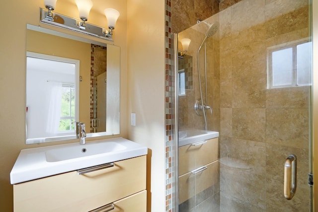 bathroom with vanity and a stall shower