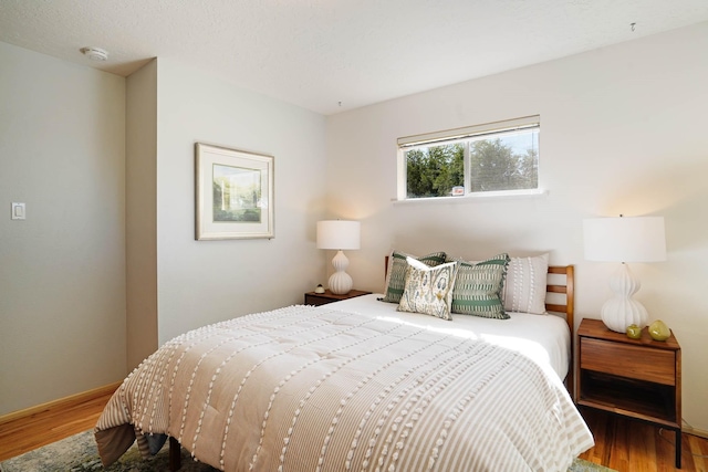 bedroom featuring wood finished floors