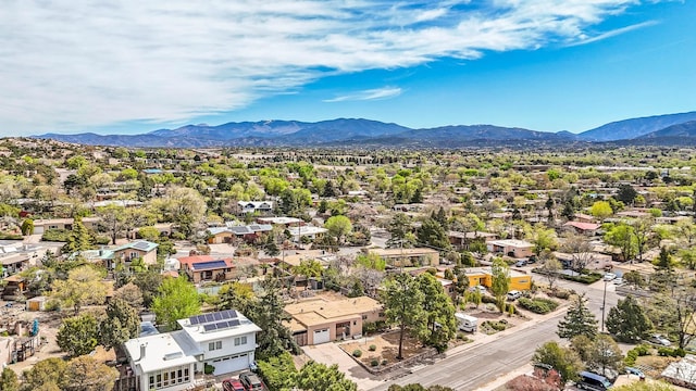 birds eye view of property with a residential view and a mountain view