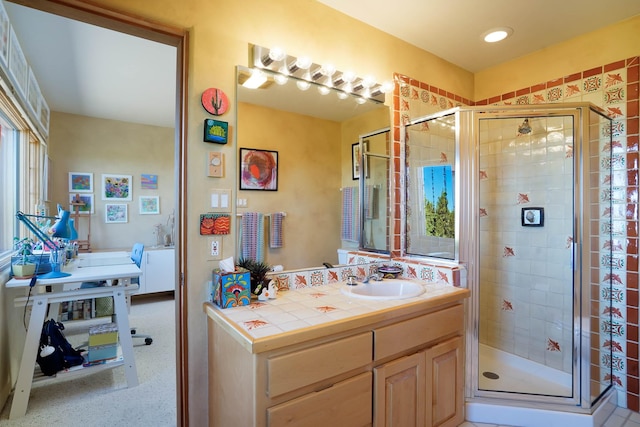 full bathroom with vanity and a stall shower