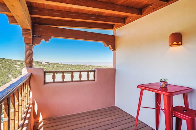 wooden deck featuring a mountain view