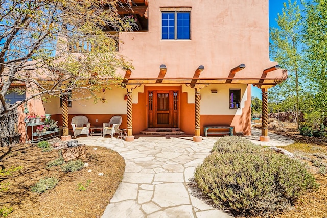 adobe home featuring stucco siding