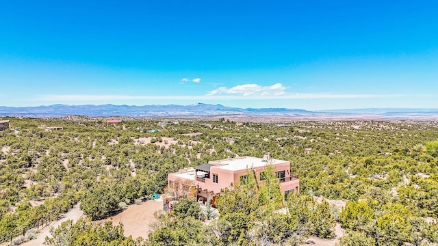 birds eye view of property with a mountain view
